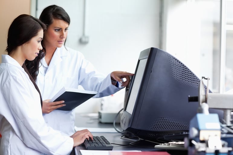 Female scientists looking at a monitor in a laboratory.jpeg